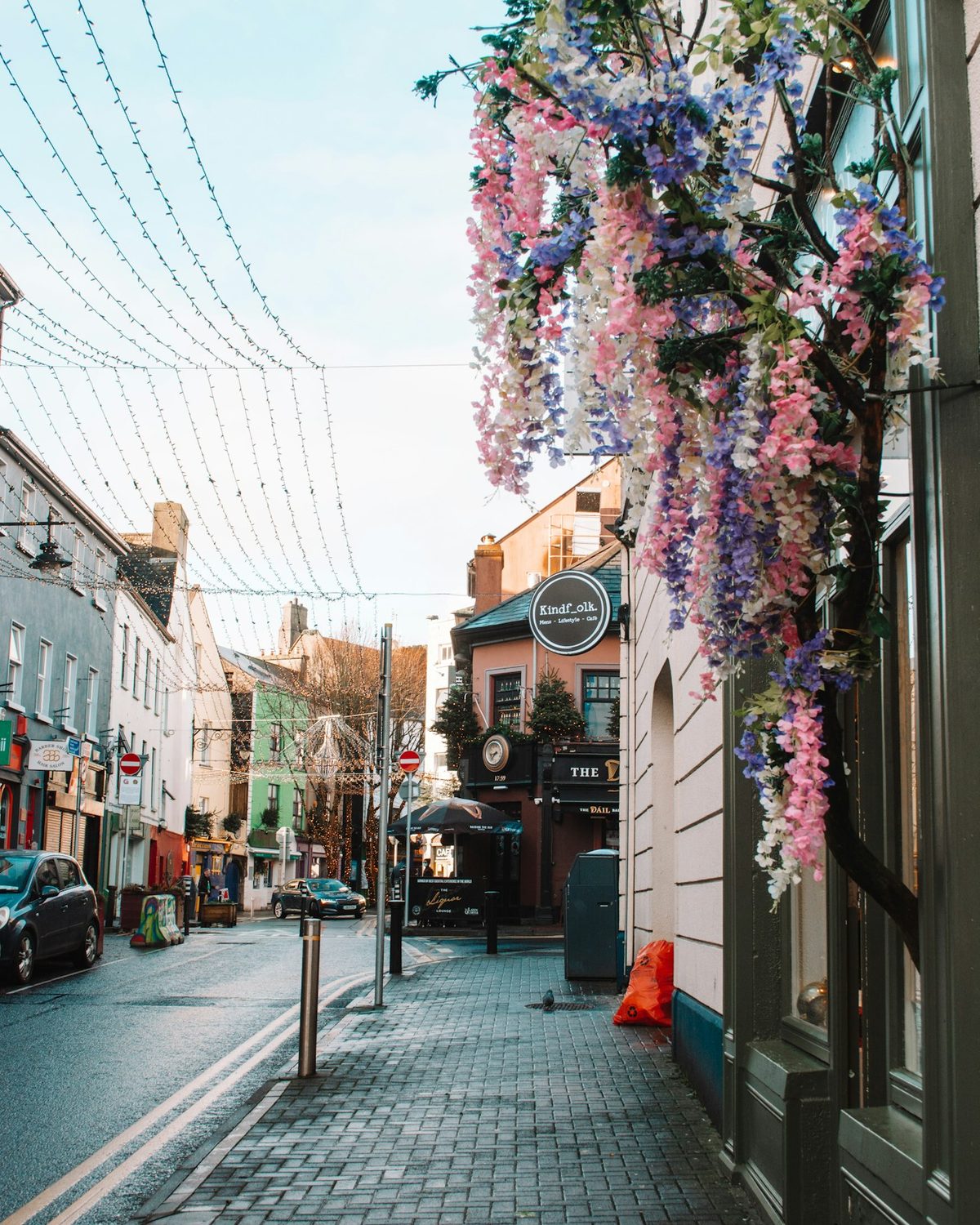 A row of independent shopfronts on an Irish town street